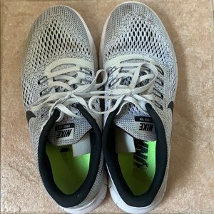 Grey, white, and black nike running shoes